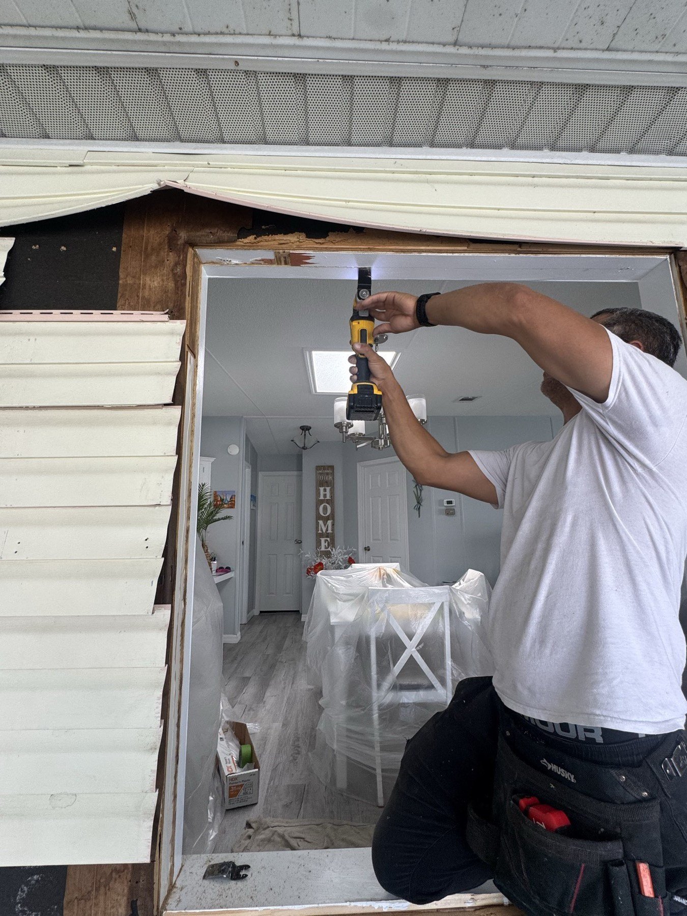KDN technician installing impact window frame